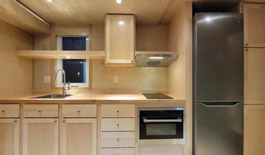 escape-eone-tall-tiny-house-with-main-floor-bedroom-002-900x527-1 Escape eOne Tall Tiny House with a Main-Floor Bedroom Option