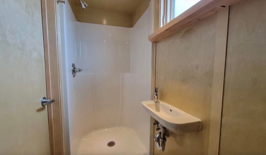 escape-eone-tall-tiny-house-with-main-floor-bedroom-009-900x526-1 Escape eOne Tall Tiny House with a Main-Floor Bedroom Option