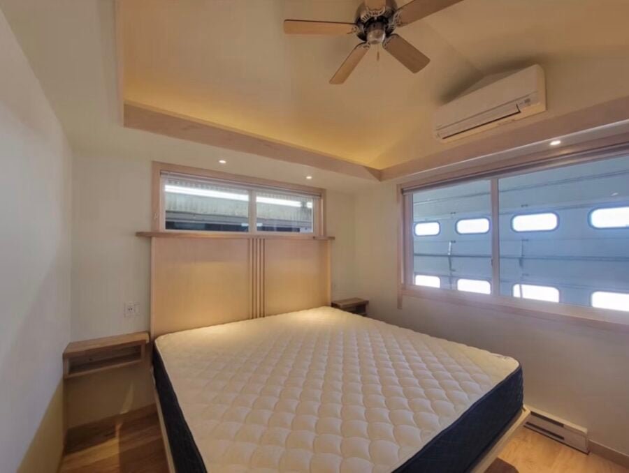 Luxurious king bedroom inside The Grove Classic King XL Tiny House, designed for comfort and relaxation with elegant decor