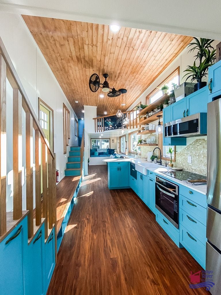 Close-up of the fun scale-pattern tile backsplash inside the Tree House tiny house kitchen.