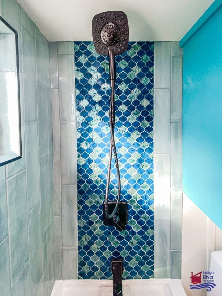 Scale-pattern tile design carried throughout the Indigo River tiny house interior.