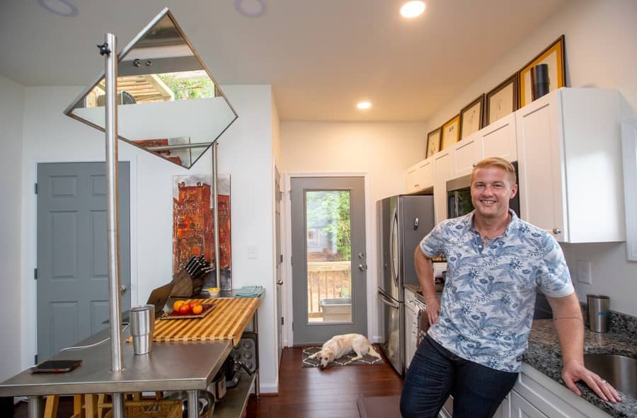Full-size kitchen inside a tiny cottage at Cottages on Vaughn with ample counter space and cabinetry.