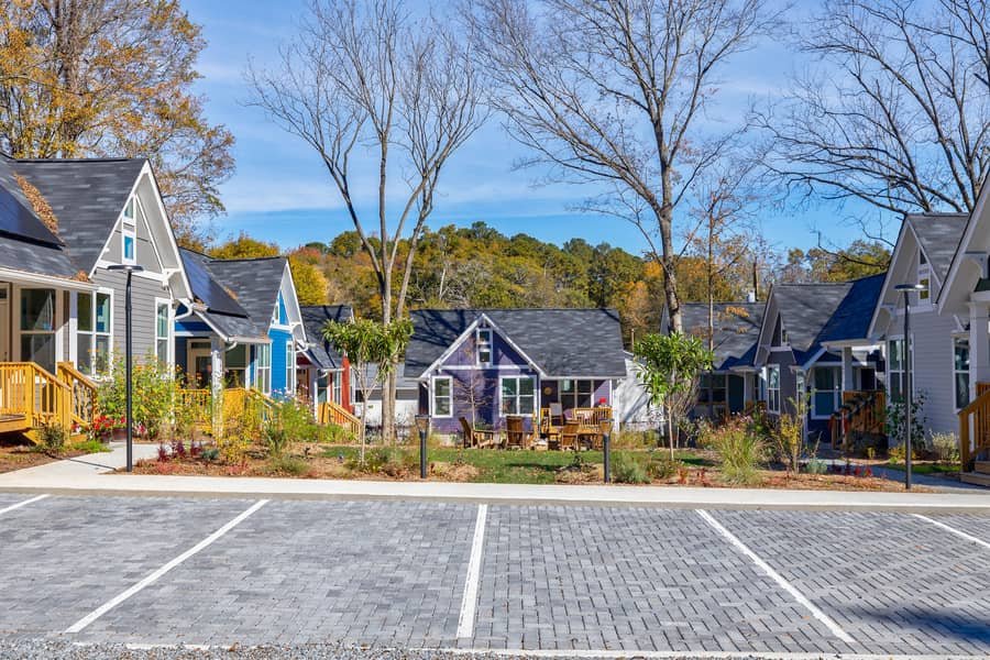 Dedicated parking spaces along the walkway in the Cottages on Vaughn tiny house community.