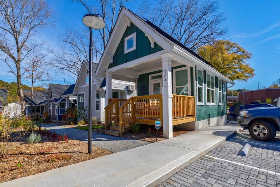 Small 250-square-foot cottage with front porch in the Cottages on Vaughn micro neighborhood.
