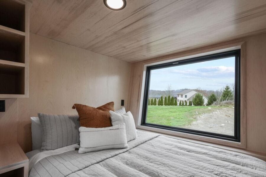 Bedroom side table and additional storage cabinetry in the Sangja tiny house.